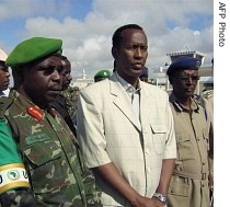 Somali Prime Minister, Ali Mohamed Gedi (center) pays tribute to the four Africa Union peacekeepers killed in an apparent assassination attempt on his life, 17 May 2007