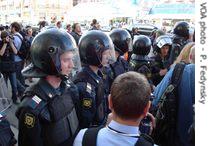 Riot police watching the demonstrators