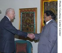 Former US President Jimmy Carter (L) shakes hands with Prachanda, leader of Nepal's Maoists during a meeting in Kathmandu, 15 June 2007