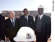 FIFA president Sepp Blatter (L) poses with Local Organizing Committee (LOC) members, Irvin Khoza chairman (C) and  Johannesburg Mayor Amos Masondo (r) at Soccer City in Johannesburg, 18 June 2007