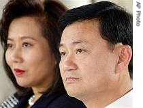 Ousted Thailand PM Thaksin Shinawatra is pictured with his wife, Pojaman in Bangkok(File Photo)