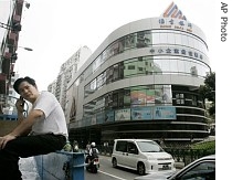 A man talks on a mobile phone in front of the headquarters of Banco Delta Asia in Macau, 16 March 2007 file photo