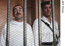 Egyptian engineer Mohammed Sayyed Saber Ali (l), 35, attends a State Security court in Cairo, 25 June 2007 