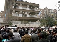 Thousands of Iraqi refugees gather outside the offices of a U.N. refugee agency in Damascus, Syria, to register their names for obtaining a refugee status, Feb 2007
