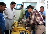 A bombing casualty, from the village of Armili, Iraq, is treated in Kirkut hospital, 7 Jul 2007