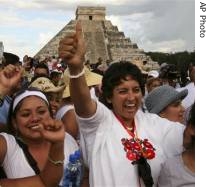 People celebrate in front of the Mayan ruins of Chichen Itza in southern Mexico, after Chichen Itza was selected as one of the new seven wonders of the world, 7 Jul 2007