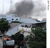 Smoke rises after an explosion outside the Dahabshil bank in Mogadishu, 7 July 2007 