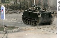 Pakistan army armored vehicle moves towards the forward positions at the Red Mosque in Islamabad, 10 July 2007