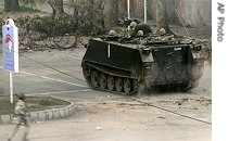 Pakistan army armored vehicle moves towards the forward positions at the Red Mosque in Islamabad, 10 July 2007