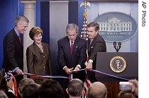 President Bush cuts the ribbon in a ceremony for the James S. Brady Press Briefing Room, Wednesday, 11 July 2007, at the White House in Washington
