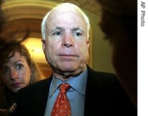 Sen. John McCain talks with reporters regarding changes to his presidential campaign staff on Capitol Hill, 10 July  2007  