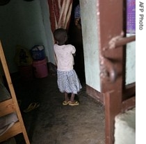 A Burundian girl stands in a room of a street children center for girls in Bujumbura, Burundi, 27 August 2005
