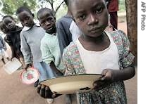 Zimbabwean children wait for food at Masarira primary school, for some it is the only meal they will have in the day, said headteacher Zvinavashe Takabvirakare (File Photo)