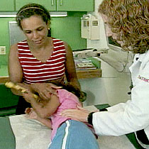 Lailani Summers is being examined as her mother looks on