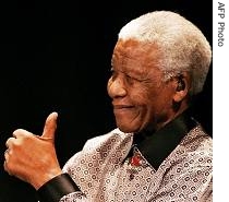 Nelson Mandela, celebrating 89th birthday, gives the thumb up as he launches, 18 Jul 2007 