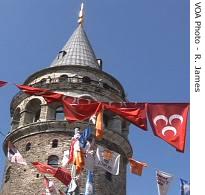 Historic Galata Tower with flags of political parties, in Istanbul, 19 Jul 2007  