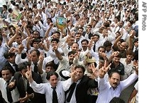 Pakistani lawyers celebrate victory after the Supreme Court reinstated suspended Chief justice Iftikhar Muhammad Chaudhry, in Lahore, 20 Jul 2007
