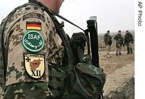 German soldiers, part of ISAF, stand guard during the opening ceremony of a German-funded medical center project in the Deh Sabz district of Kabul (file photo)<br />
