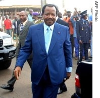 Cameroon's President Paul Biya walks past a car  after the end of polling for municiple and legislative elections in the residential quater Bastos in Yaounde, 22 Jul 2007