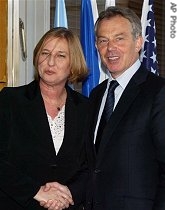 New Quartet Mideast Envoy and Former British Prime Minister Tony Blair (r) shakes hands with Israel's Foreign Minister Tzipi Livni prior to their meeting in Jerusalem, 23 Jul 2007