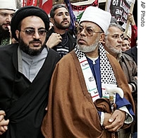 Sheik Taj Aldin al-Hilali, in brown cape, joins members of Sydney's Lebanese community in a march through Sydney's central business district in this July 2006 file photo