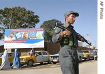 An Afghan policeman stands guard at a check point in an effort to find the Korean hostages, 2 Aug 2007