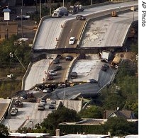 An aerial view of the Interstate 35W bridge over the Mississippi River in Minneapolis, after it collapsed, 02 Aug 2007