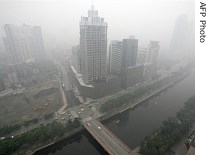 Chengdu, China is covered in a heavy haze, caused by tons of dry stalks burning on the city's outskirts, 10 May 2007