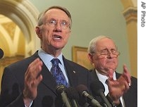 Senate Majority Leader Harry Reid, (r), talks to reporters following vote on an amendment to Defense Authorization Bill on Capitol Hill, 18 July 2007 