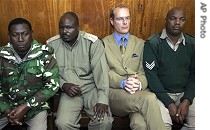 Thomas Cholmondeley sits in courtroom, surrounded by prison wardens (file photo)