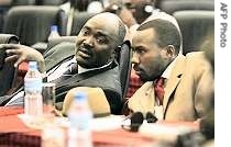 Faction leaders for SLM Khamis Abdalla Abakar, left, and SLA Ahmed Abdulshafi chat during a session of AU-UN sponsored negotiations in Tanzania, 06 Aug 2007 <br />