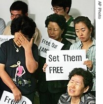 Relatives of South Koreans kidnapped in Afghanistan weep during a press conference in Sungnam, south of Seoul, South Korea, 7 Aug 2007
