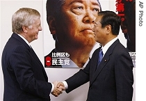 U.S. Ambassador to Japan Thomas Schieffer, left, is greeted by Japan's main opposition Democratic Party of Japan leader Ichiro Ozawa prior to their meeting at Ozawa's office in Tokyo Wednesday, 8 Aug. 2007
