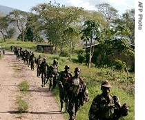 UPDF soldiers patrol near the border with Congo after they engaged rebels from the Congolese Allied Democratic Force (ADF) in a fierce battle, 28 March 2007