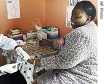 Nozizwe Madlala-Routledge has a blood sample taken to test for AIDS in Port Shepstone, South Africa, in this Nov. 2006 photograph