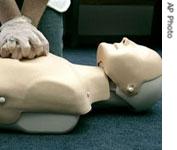Chest compressions on a CPR training dummy