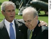 President Bush, left, puts his arm around Karl Rove as they appear before reporters during a news conference announcing Rove's resignation, 13 Aug 2007
