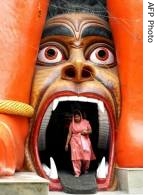 An Indian Hindu devotee leaves a new temple dedicated to and made in a likeness of Lord Hanuman the monkey god of Hindu mythology in New Delhi  