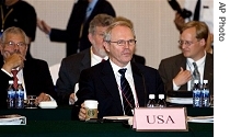 U.S. envoy Christopher Hill, center, sits with his delegate members attending the 2nd working group meeting on North Korea's nuclear program in Shenyang, China, Thursday, 16 Aug. 2007
