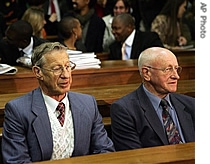 South Africa's former law and order Minister Adriaan Vlok, right, with ex-police chief Johan van der Merwe, left, sit inside of High Court room in Pretoria, South Africa, 17 Aug 2007