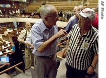 Israeli Holocaust survivors leave the Knesset, Israel's parliament, after a recent agreement between the government and the survivors, in Jerusalem, 20 Aug 2007