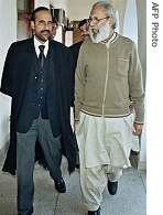Hedayat Noor, right, father of Pakistani Al-Qaeda terror network's computer technician Naeem Noor Khan walks with his lawyer Babar Awan after a hearing at a court in Rawalpindi <br>(File photo - 14 Dec 2004)