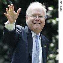 White House Deputy Chief of Staff Karl Rove waves upon his return to the White House in Washington, 24 July 2007