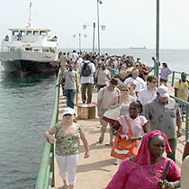 Tourist travel by ferry to Goree Island