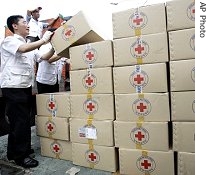 South Korean workers from Korea Red Cross prepare aid supply kits for North Korean victims at Red Cross branch in Seoul, South Korea, 22 Aug 2007 