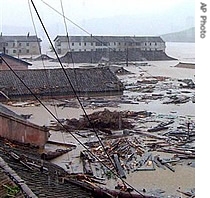 Photo distributed by North Korea's official Korean Central News Agency, shows destruction caused by floods in Kangwon, North Korea