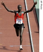 Kenya's Luke Kibet celebrates as he wins the Men's Marathon at the World Athletics Championships in Osaka, Japan, 25 Aug. 2007 
