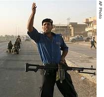 Members of the joint Iraqi security forces block a road  after unidentified gunmen open fire to threat pilgrims in southwestern Baghdad, 27 Aug 2007