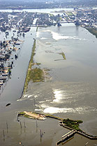 Two breeches in the Florida Street levee, looking toward the Mississippi River, are shown Tuesday, Aug. 30, 2005, in New Orleans after Hurricane Katrina moved through the area.