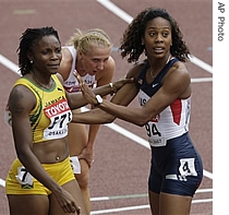 Jamaica's Aleen Bailey, left, and USA's Sanya Richards congratulate each other as Poland's Ewelina Klocek catches her breath after competing in a heat of the Women's 200m race at the World Athletics Championships, 29 Aug 2007